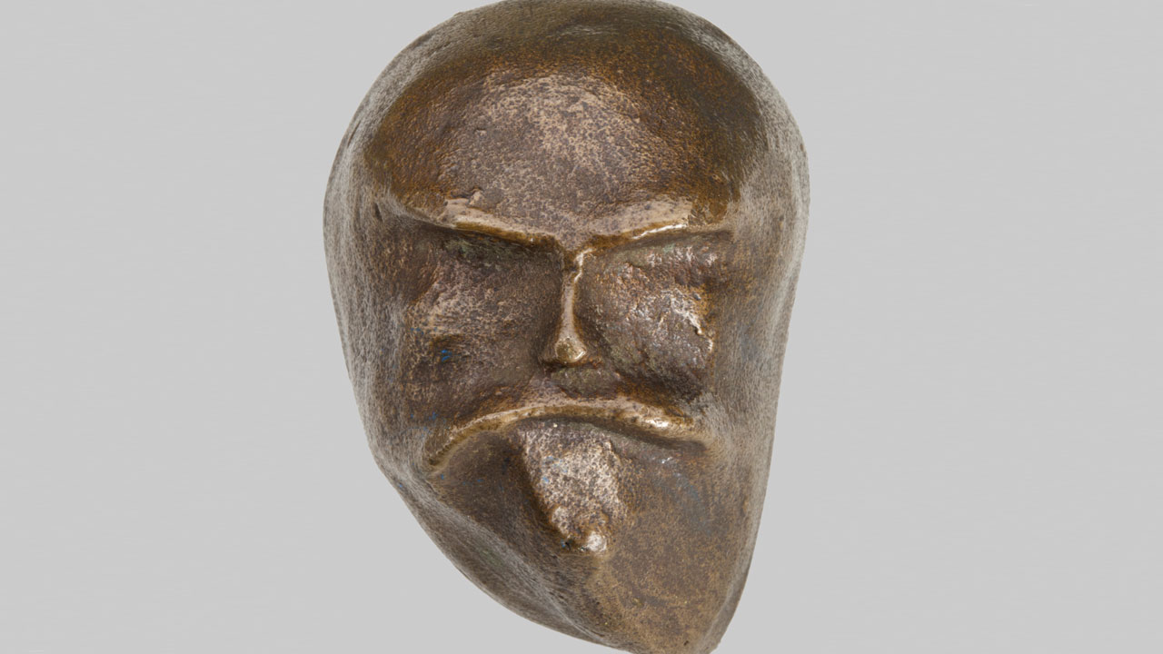 bronzen masker/kopje